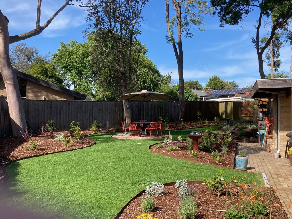 Completed backyard landscaping with lawn and patio